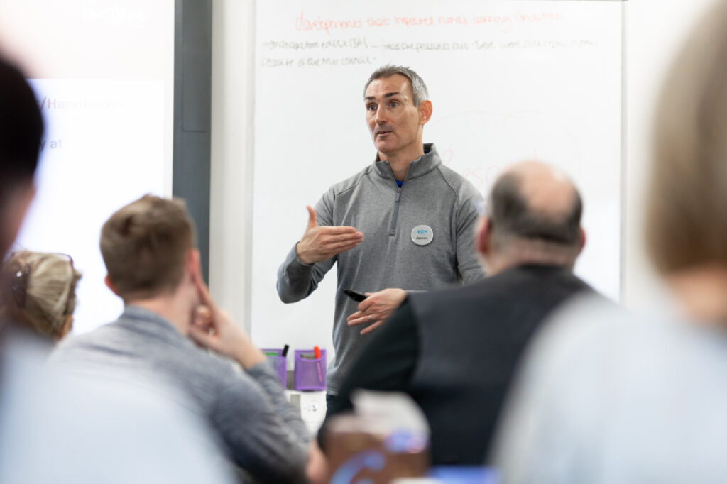 Training Director James Crown of IKON teaching de-escalation to a class full of learners.